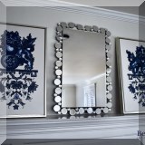 A02. Pair of framed foo dogs on canvas. 